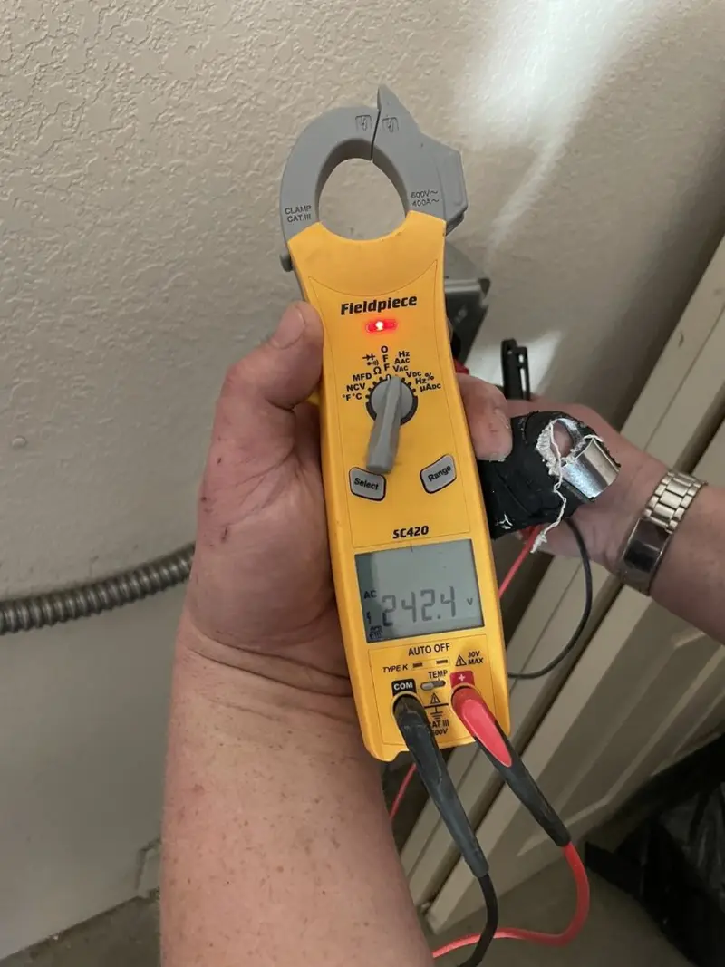 Voltage testing with clamp meter during Whole House Surge Protector in Richmond